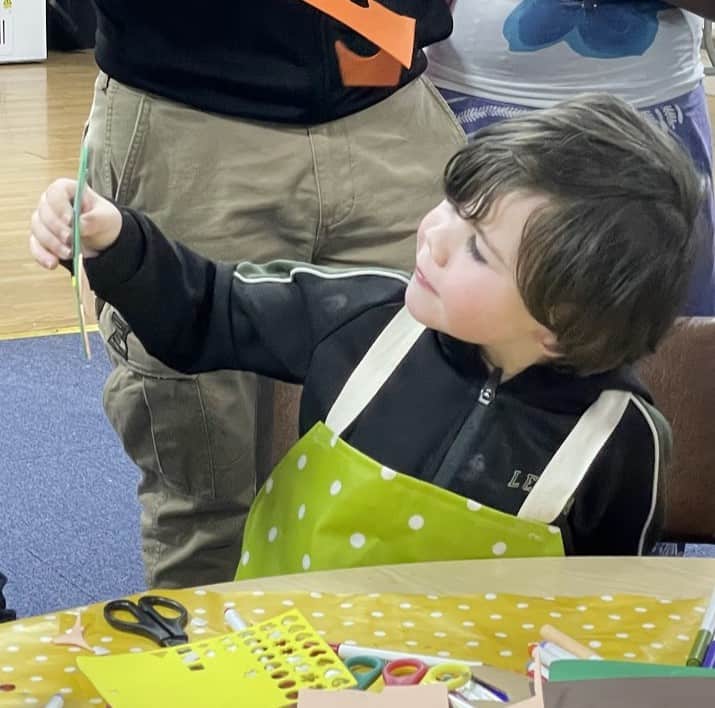 Boy looking at craft