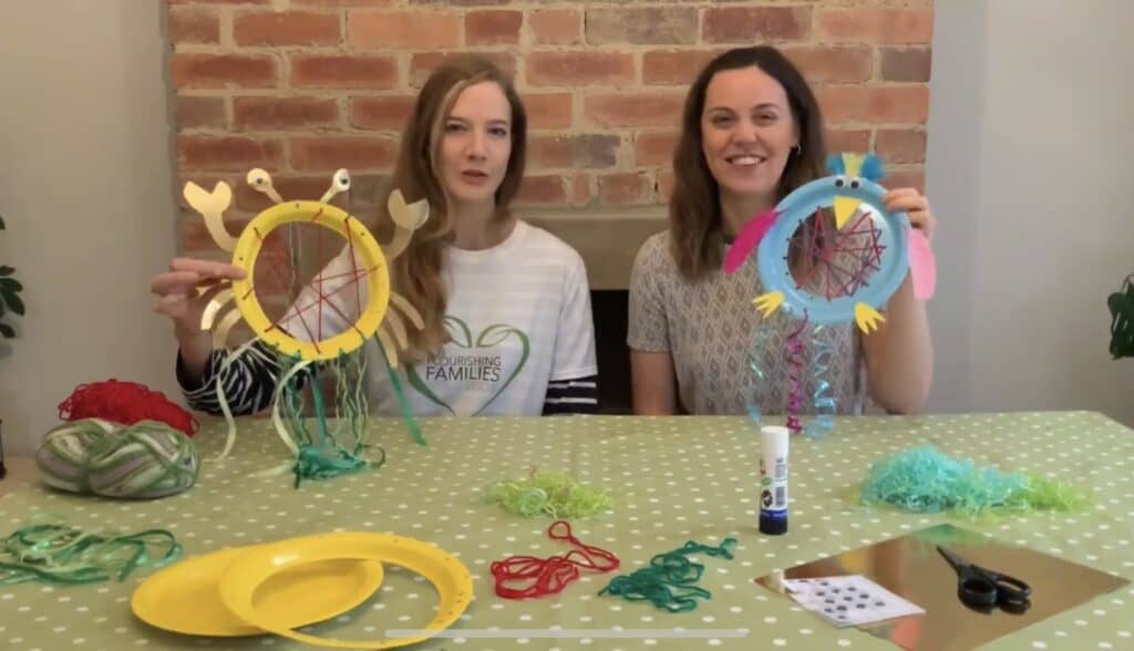 Two women holding craft