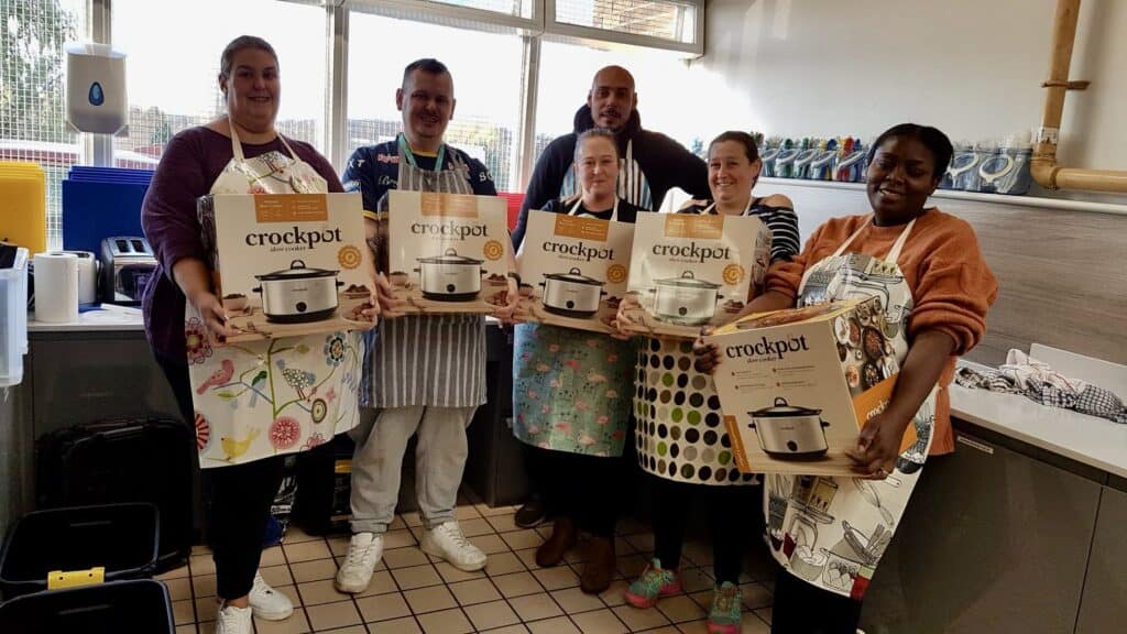 Group of people with slow cookers